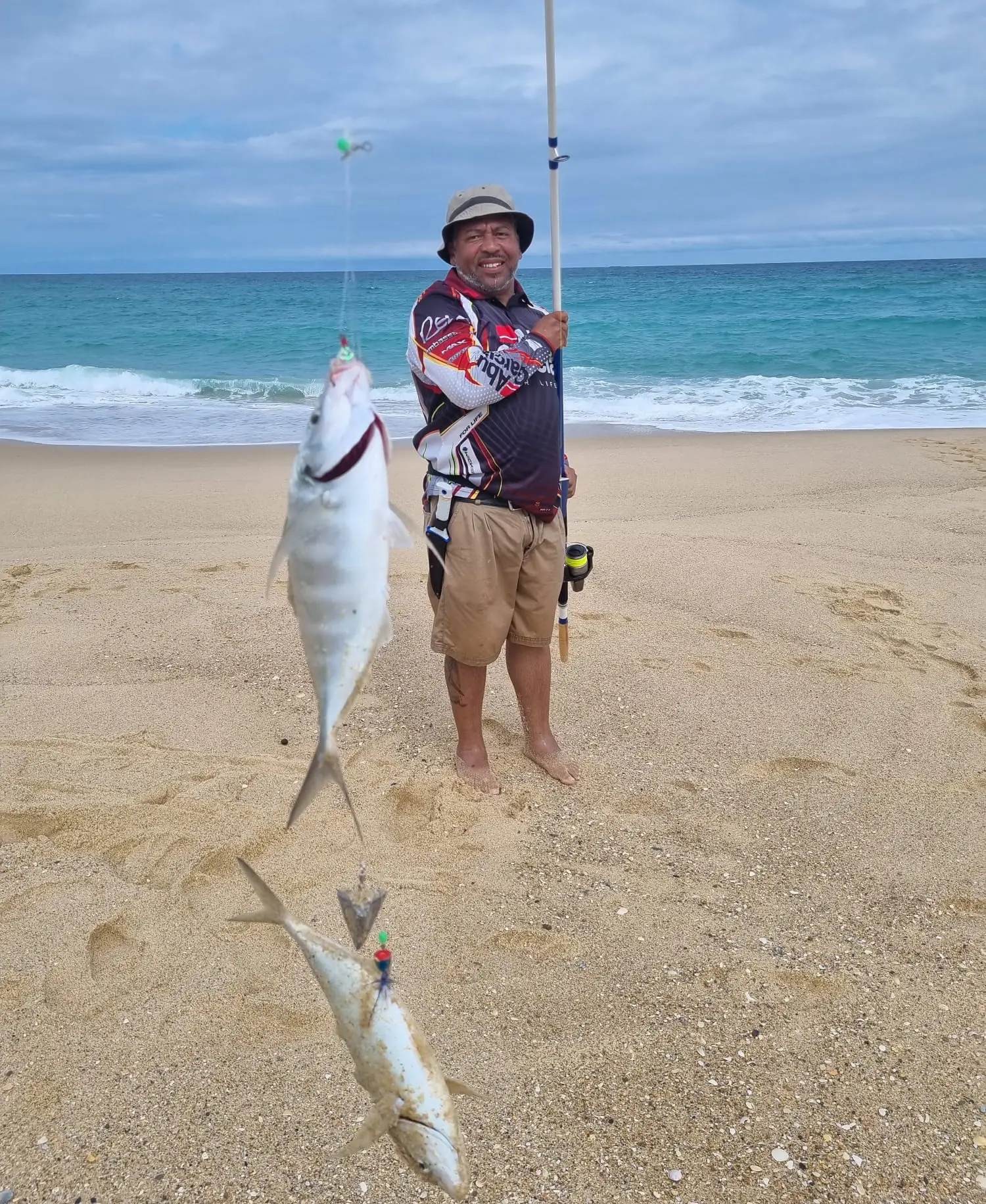 a man catching two fishes